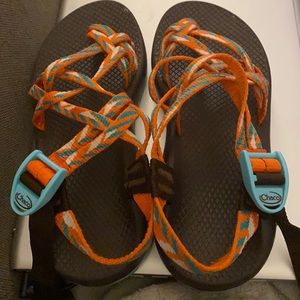 Orange and turquoise women’s Chaco sandals